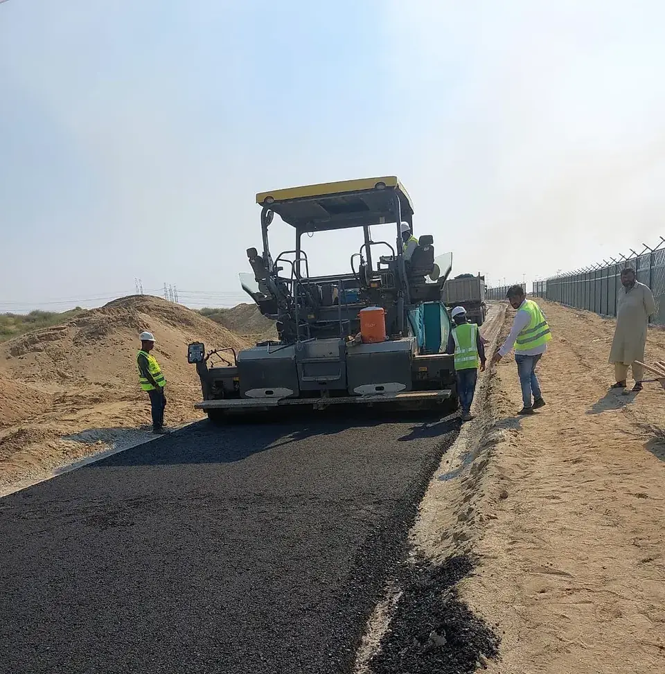 Asphalt laying along the perimeter road
