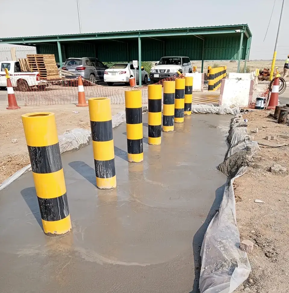 Row of anti-ram bollards on a new concrete base