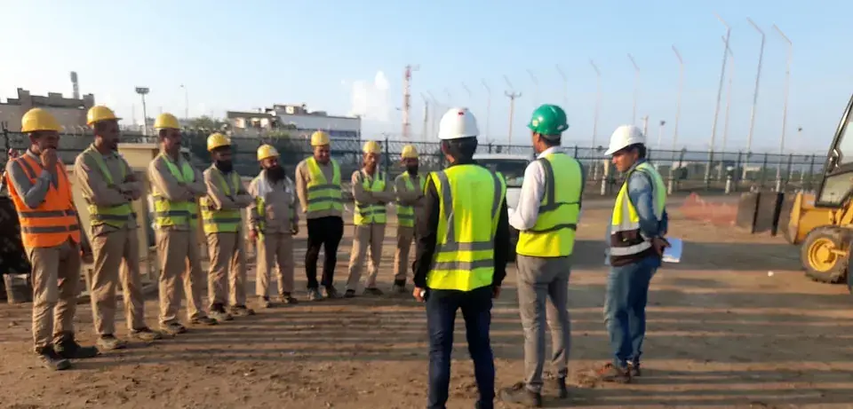 Site crew lined up for the daily briefing