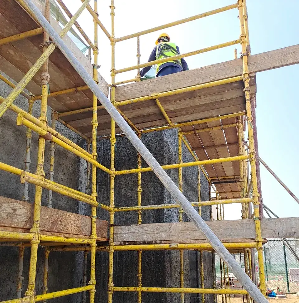 Scaffold access for waterproofing a retaining wall